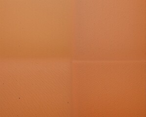 Fototapeta premium A textured orange surface divided into four sections, showcasing a smooth, even finish with subtle variations.