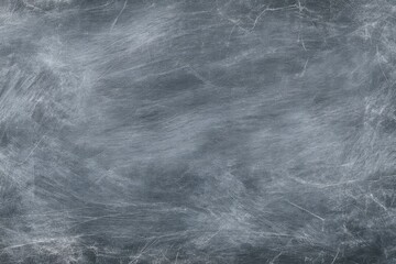 Fototapeta premium A subtly textured light-gray chalkboard surface offers a seamless backdrop with delicate smudges, ideal for creative projects.