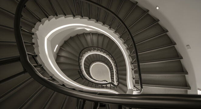 Abstract Spiral Staircase Design From Below in Monochrome Architecture