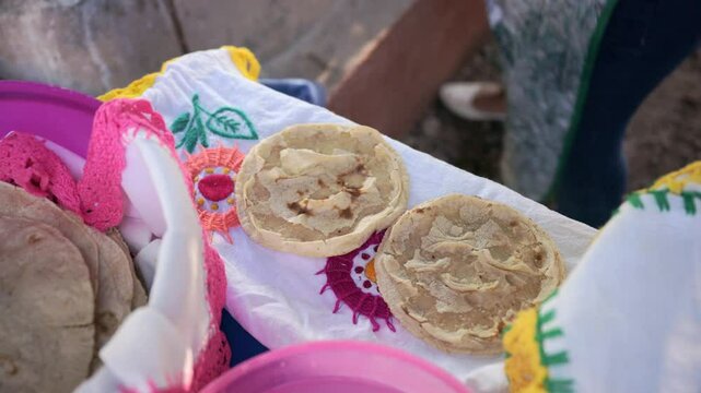 Mexican woman making a corn tortillas in a traditional way