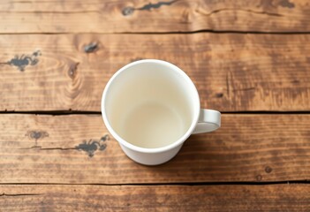 Empty paper coffee cup mockup on rustic wood surface,  tabletop, simple
