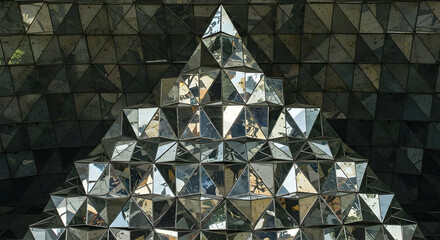 Geometric Reflections Pyramid Composed Of Mirrored Surfaces Creating An Abstract Structure
