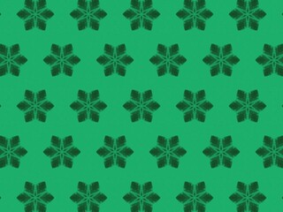 An abstract background with a repeating pattern of dark green, stylized starburst shapes on a brighter green backdrop, creating a subtle yet textured design.