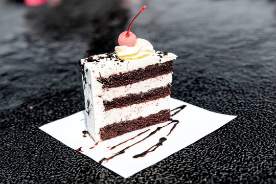 Delicious chocolate cake slice with cherry dessert food photography