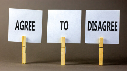 Agree to disagree symbol. Concept words Agree to disagree on beautiful white paper on wooden...