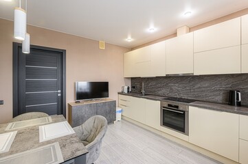 interior apartment kitchen and dining room, refectory area, cooking equipment, table furniture, stove