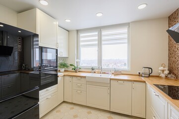 interior apartment kitchen and dining room, refectory area, cooking equipment, table furniture, stove