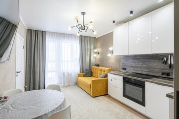 interior apartment kitchen and dining room, refectory area, cooking equipment, table furniture, stove