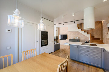 interior apartment kitchen and dining room, refectory area, cooking equipment, table furniture, stove