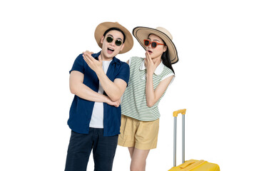 portrait of asian couple wearing travel clothes,  suitcases and posing on white background