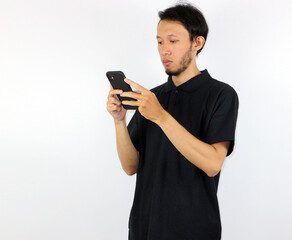 Man Using Mobile Phone While Standing Against White Background