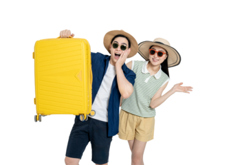 portrait of asian couple wearing travel clothes, carrying suitcases and posing on white background
