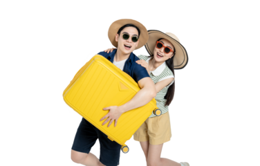 portrait of asian couple wearing travel clothes, carrying suitcases and posing on white background