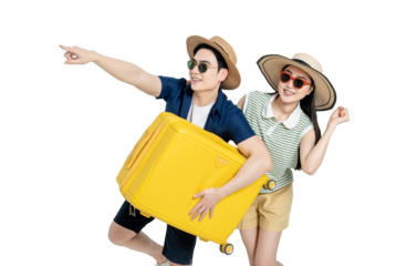 portrait of asian couple wearing travel clothes, carrying suitcases and posing on white background