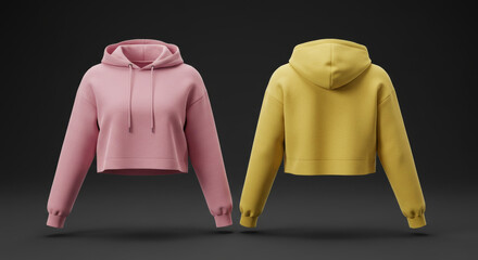 Pink and mustard yellow cropped hoodies displayed in a studio setting. Female adult casual wear apparel presented with a neutral background.