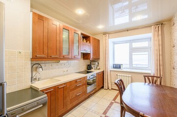 interior apartment kitchen and dining room, refectory area, cooking equipment, table furniture, stove