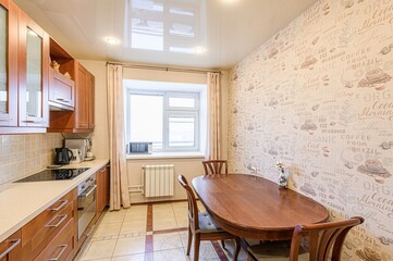 interior apartment kitchen and dining room, refectory area, cooking equipment, table furniture, stove