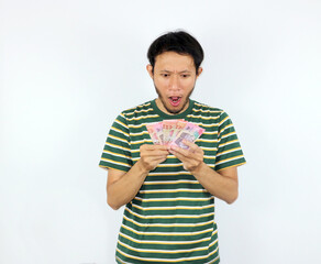 Man Holding Money with Surprised Expression on White Background