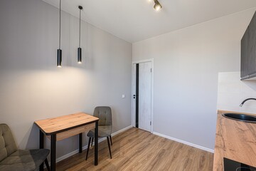 interior apartment kitchen and dining room, refectory area, cooking equipment, table furniture, stove