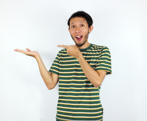 Man Presenting with Hand and Finger, Excited Expression on White Background