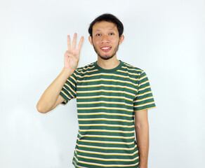 Person Showing Three Fingers in Studio with Striped Shirt Smiling