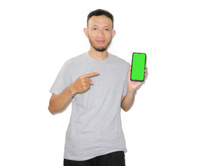 Man Presenting Smartphone with Green Screen Ready for App Mockup