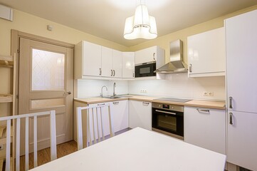 interior apartment kitchen and dining room, refectory area, cooking equipment, table furniture, stove