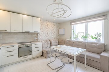 interior apartment kitchen and dining room, refectory area, cooking equipment, table furniture, stove