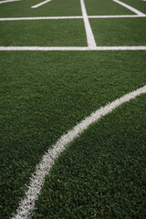 Fototapeta premium Close-Up of Sports Field Green with Crisp White Lines - Professional Ground Texture for Athletic Branding & Event Graphics