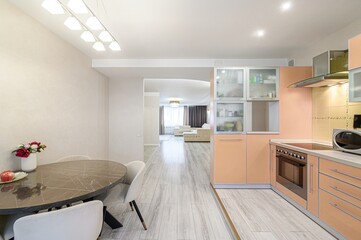 interior apartment kitchen and dining room, refectory area, cooking equipment, table furniture, stove