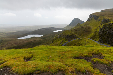 The Quiraing, Isle of Skye lush green landscapes, pure air, dramatic cliffs. A surreal trail through wild nature, perfect for trekking, silence, breathing untouched beauty, mystical rock formations.