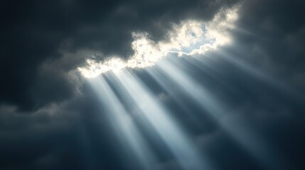 Fototapeta premium Solar energy equipment under cloudy sky with beams of light breaking through