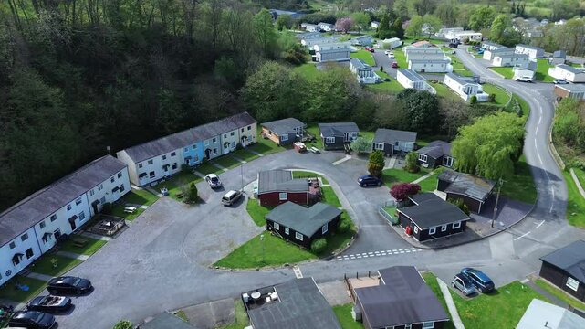 4K drone aerial of Glan Gwna over tree line, Caernarfon at Daytime, Wirral, UK