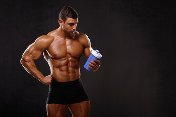 Muscular Man Holding Protein Shake Bottle , Nutritional Supplement