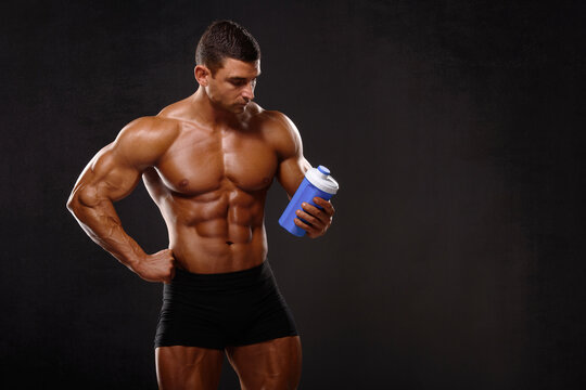 Muscular Man Holding Protein Shake Bottle , Nutritional Supplement