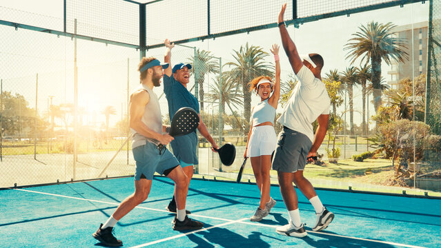 Happy people, tennis and high five with team in celebration for good game, match or well played. Excited, padel group or friends with smile in unity for winning, victory or sport together on court
