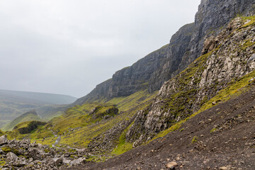 The Quiraing, Isle of Skye lush green landscapes, pure air, dramatic cliffs. A surreal trail through wild nature, perfect for trekking, silence, breathing untouched beauty, mystical rock formations.