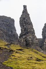 The Quiraing, Isle of Skye lush green landscapes, pure air, dramatic cliffs. A surreal trail through wild nature, perfect for trekking, silence, breathing untouched beauty, mystical rock formations.