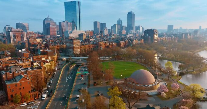 Beautiful scenery of Boston, Massachusetts, USA near the waterfront of the Charles River. Aerial perspective on the city from above the lively roads.