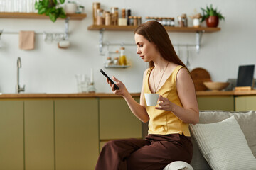Enjoying a quiet morning while sipping coffee and checking messages in a cozy kitchen