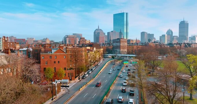 Orange houses of Boston, Massachusetts, USA. Drone footage above the busy roads leading to and from downtown.