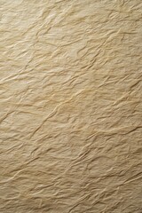 Textured tan paper background with delicate folds and subtle light creating a warm organic feel perfect for design and artistic projects