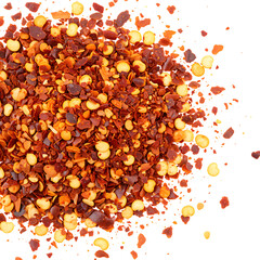 Red pepper flakes crushed chili flakes spice seasoning ingredient cooking food photography close up macro shot on transparent background