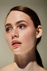 Captivating beauty of a young woman illuminated by soft light in a serene moment