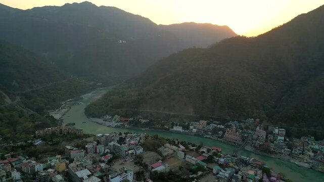 beautiful sunrise behind the mountains in Rishikesh drone view in India