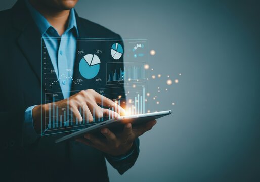 Businessman analyzing digital data on tablet - Powered by Adobe