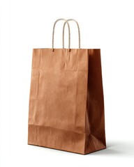 Isolated brown paper shopping bag with rope handles on white background studio shot minimalistic style for retail sales and sustainable packaging concept