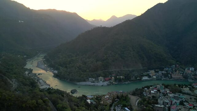 beautiful sunrise behind the mountains in Rishikesh drone moving left to right view in India