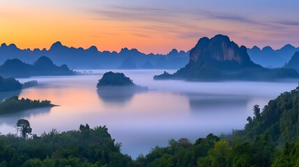 Fototapeta premium Serene Sunrise over Misty Mountains and Calm Lake Breathtaking Landscape