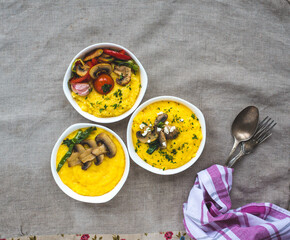 Delicious vegan homemade dishes with corn porridge and grilled vegetables. Polenta with vegetables. Healthy food for every day for vegans.